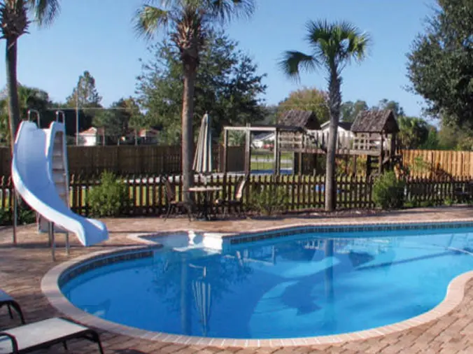 back yard pool with water slide