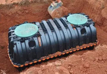 Septic tank being installed in ground