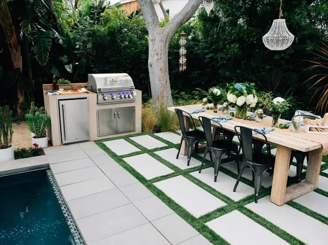 Backyard gas grill with table and chairs