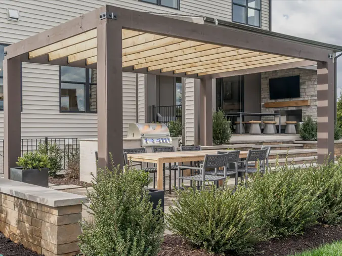 Backyard trellace with gas grill underneath