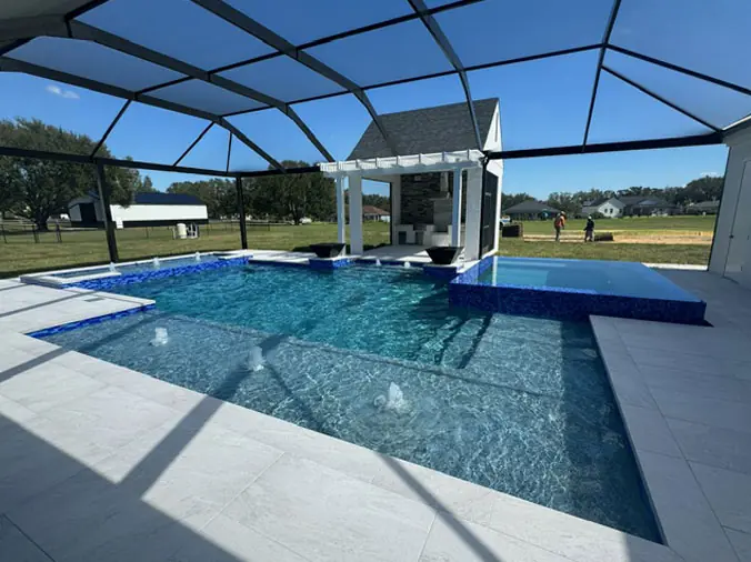 OUtdoor swiming pool with glass enclosure